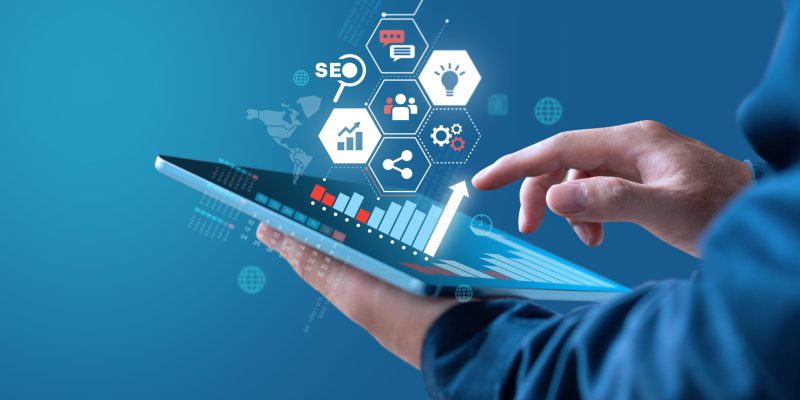 Businessman show growth graph of earning with digital marketing strategy.